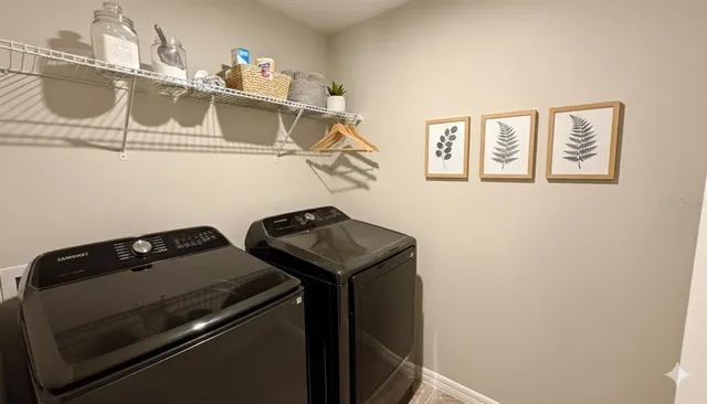 a view of a swimming pool with an outdoor seating and trees