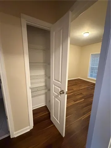 a view of an empty walk in closet