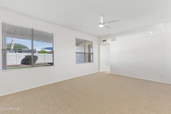 a view of an empty room with a window