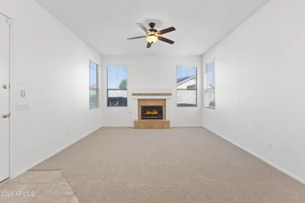 a view of an empty room with a fireplace