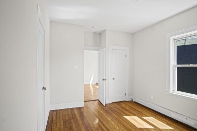 12 Redfield Street, Unit 3 Boston, MA 02122 - Photo 6 of 13 a view of room with window and hardwood floor