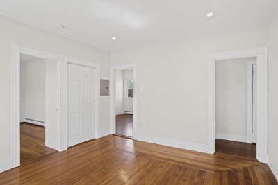12 Redfield Street, Unit 3 Boston, MA 02122 - Photo 7 of 13 a view of empty room with wooden floor