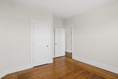 12 Redfield Street, Unit 3 Boston, MA 02122 - Photo 10 of 13 a view of an empty room and wooden floor