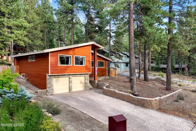 a backyard of a house with fountain and barbeque oven
