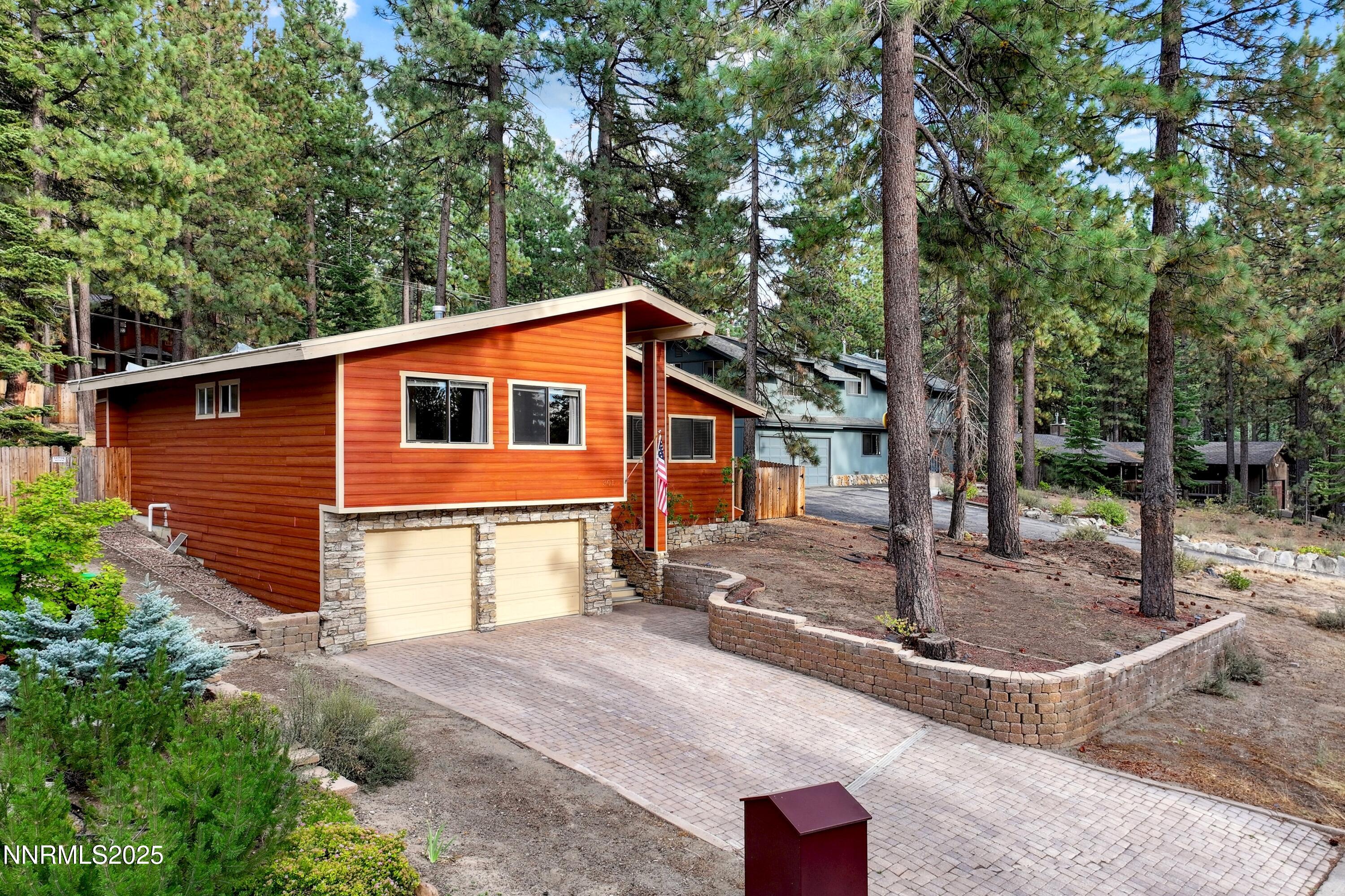 301 Chimney Rock Road Stateline, NV 89449 - Photo 1 of 38 a backyard of a house with fountain and barbeque oven
