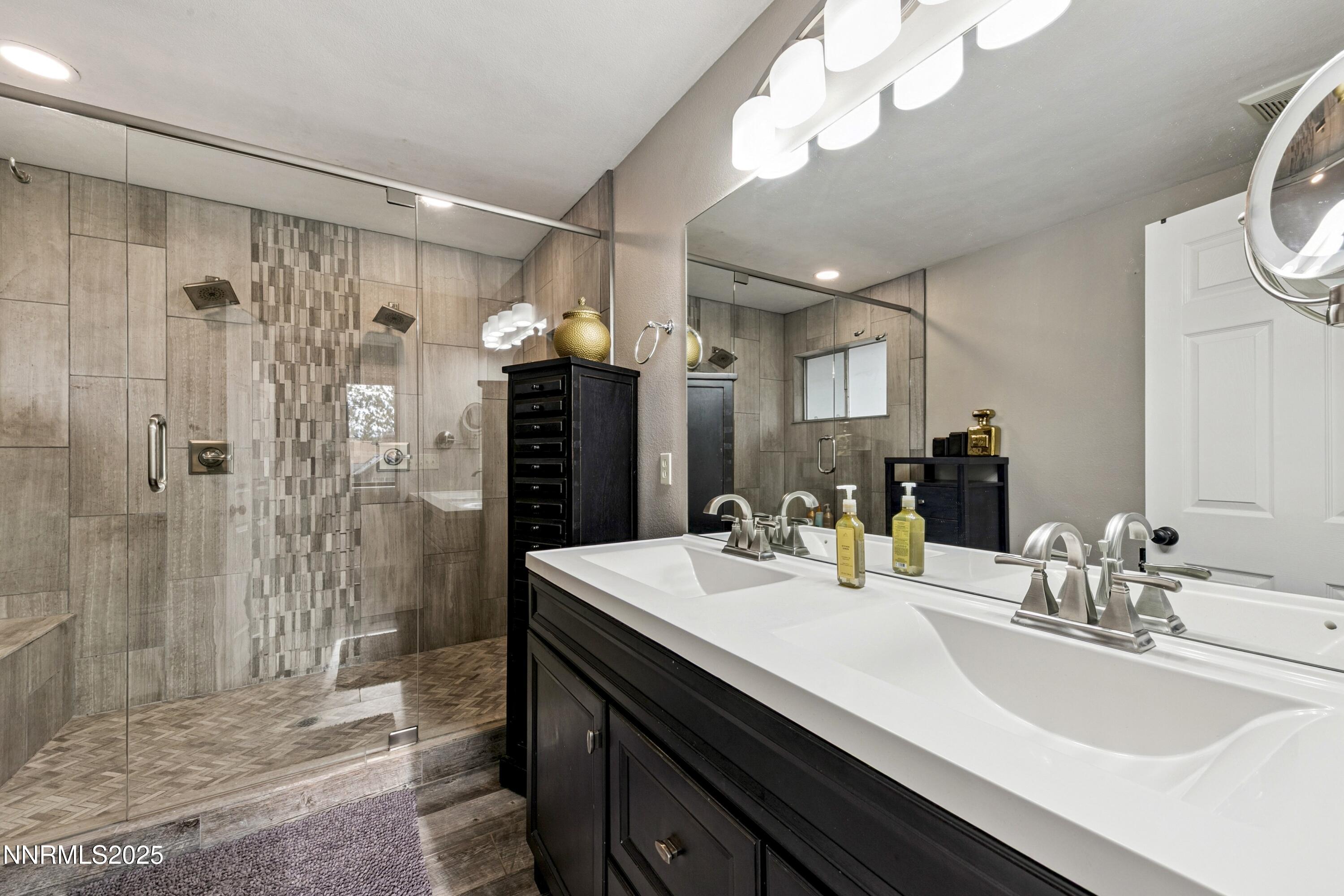 301 Chimney Rock Road Stateline, NV 89449 - Photo 15 of 38 a bathroom with a sink a toilet and shower