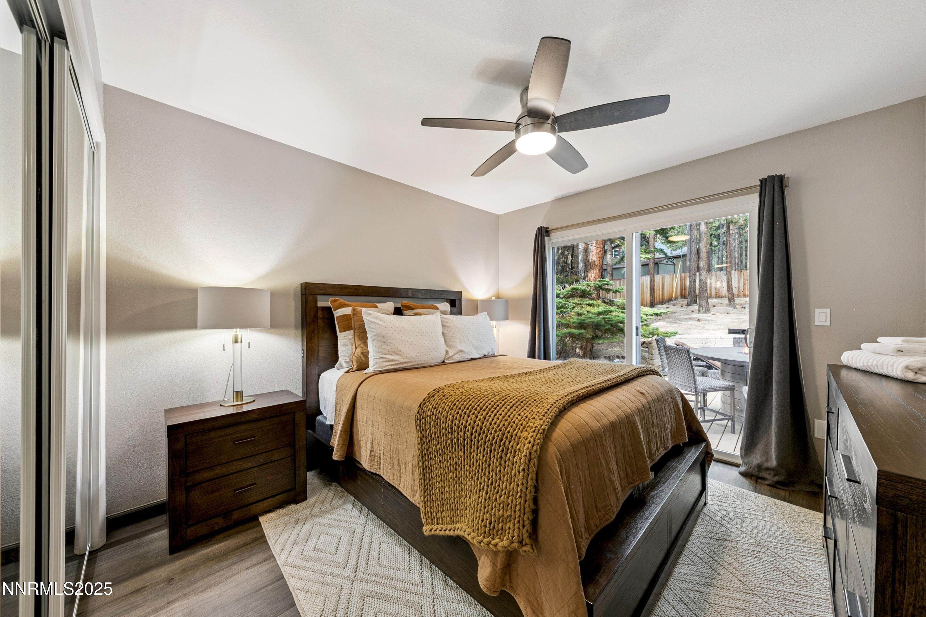 301 Chimney Rock Road Stateline, NV 89449 - Photo 17 of 38 a bedroom with a bed and wooden floor