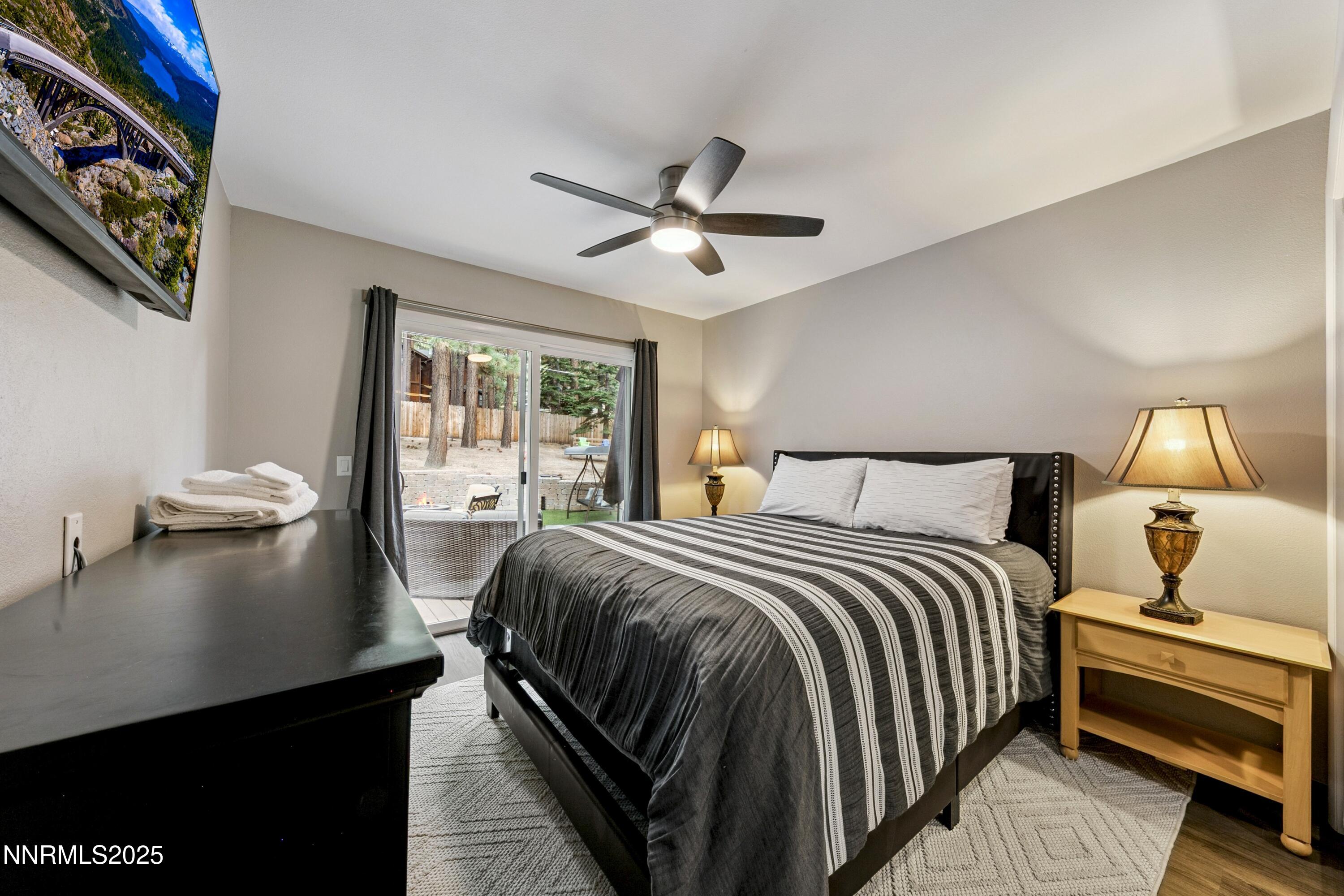 301 Chimney Rock Road Stateline, NV 89449 - Photo 19 of 38 a bedroom with a bed and a night stand