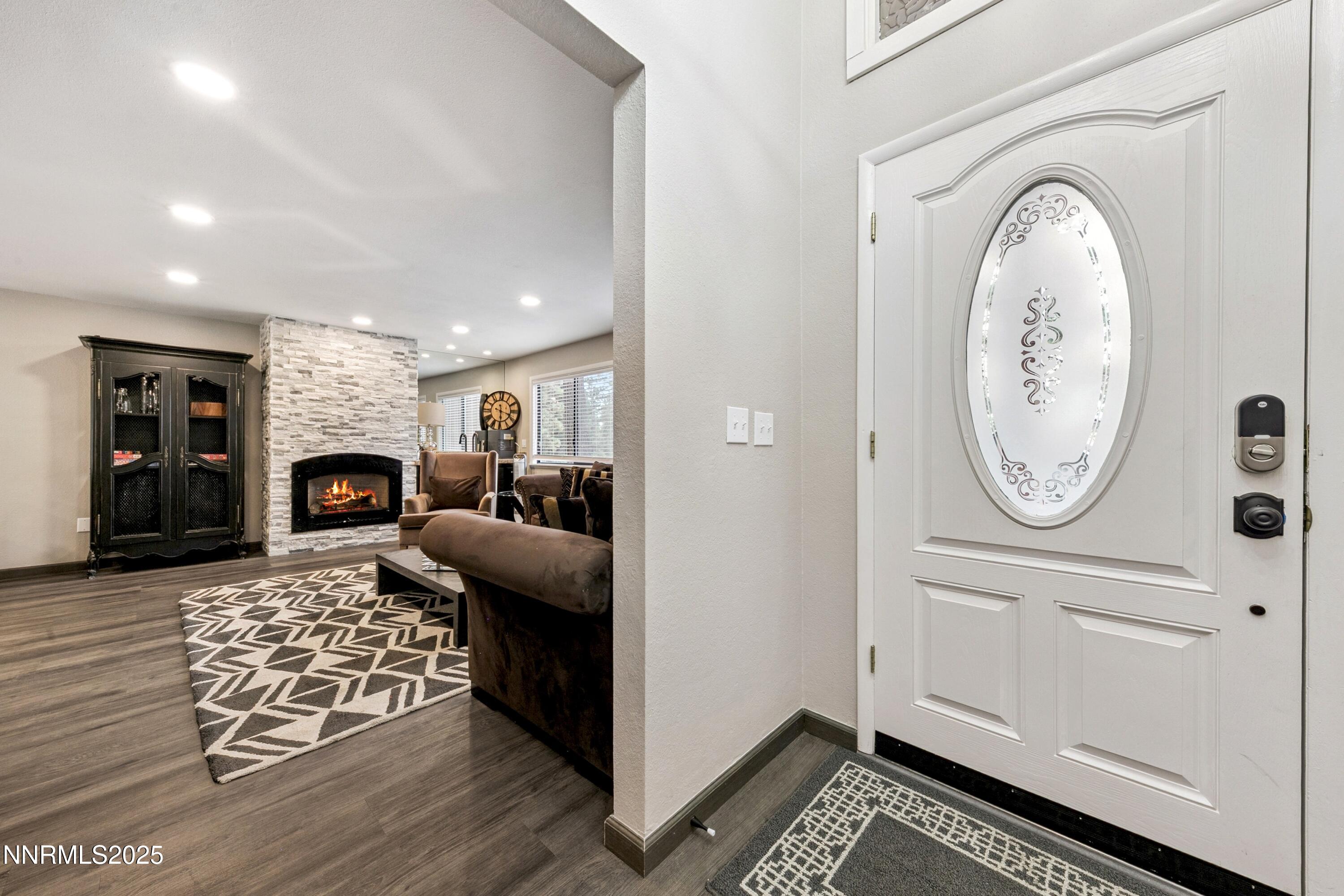 301 Chimney Rock Road Stateline, NV 89449 - Photo 2 of 38 a living room with furniture a fireplace and wooden floor