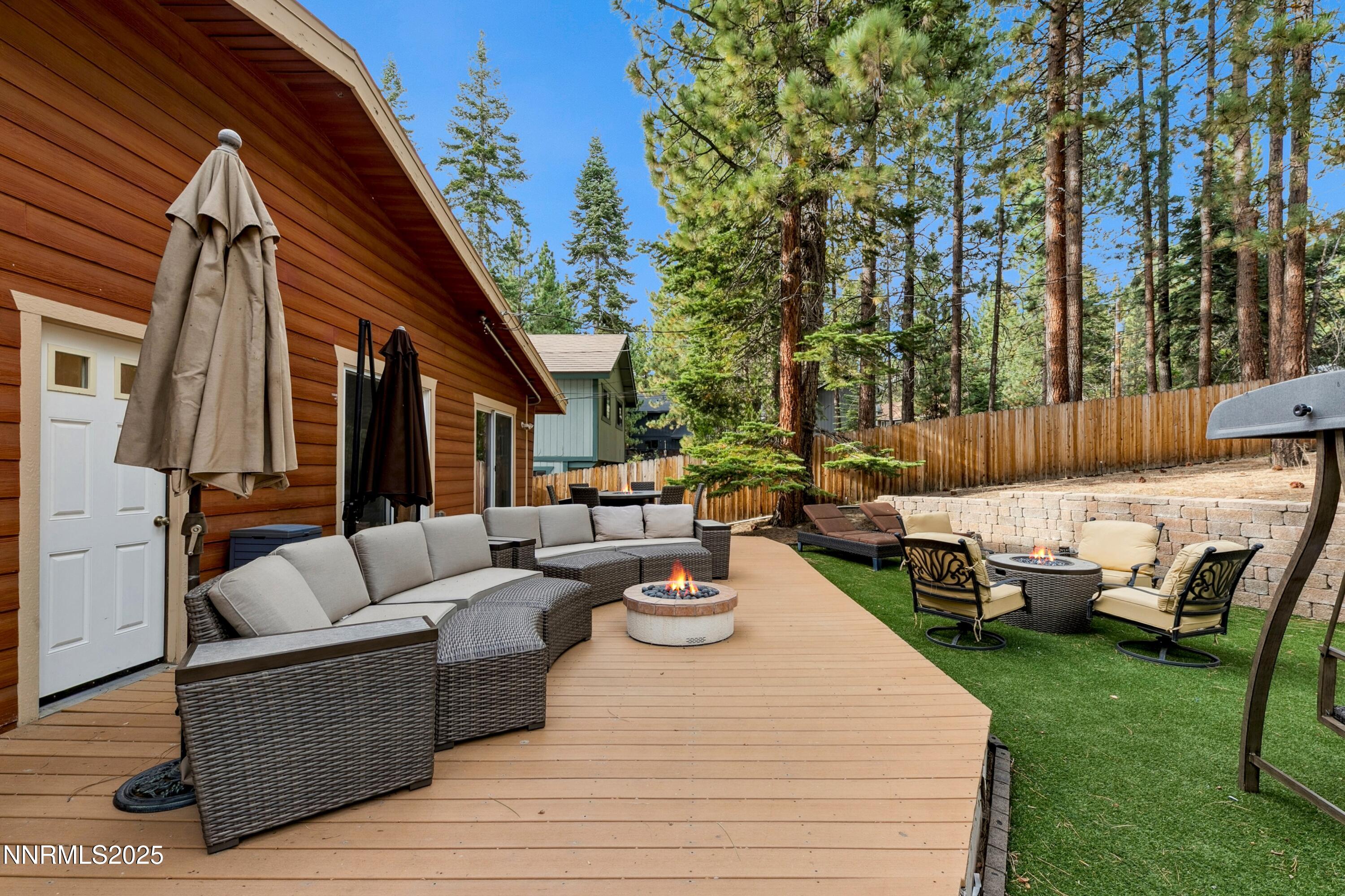 301 Chimney Rock Road Stateline, NV 89449 - Photo 21 of 38 a view of outdoor space yard deck patio and fire pit