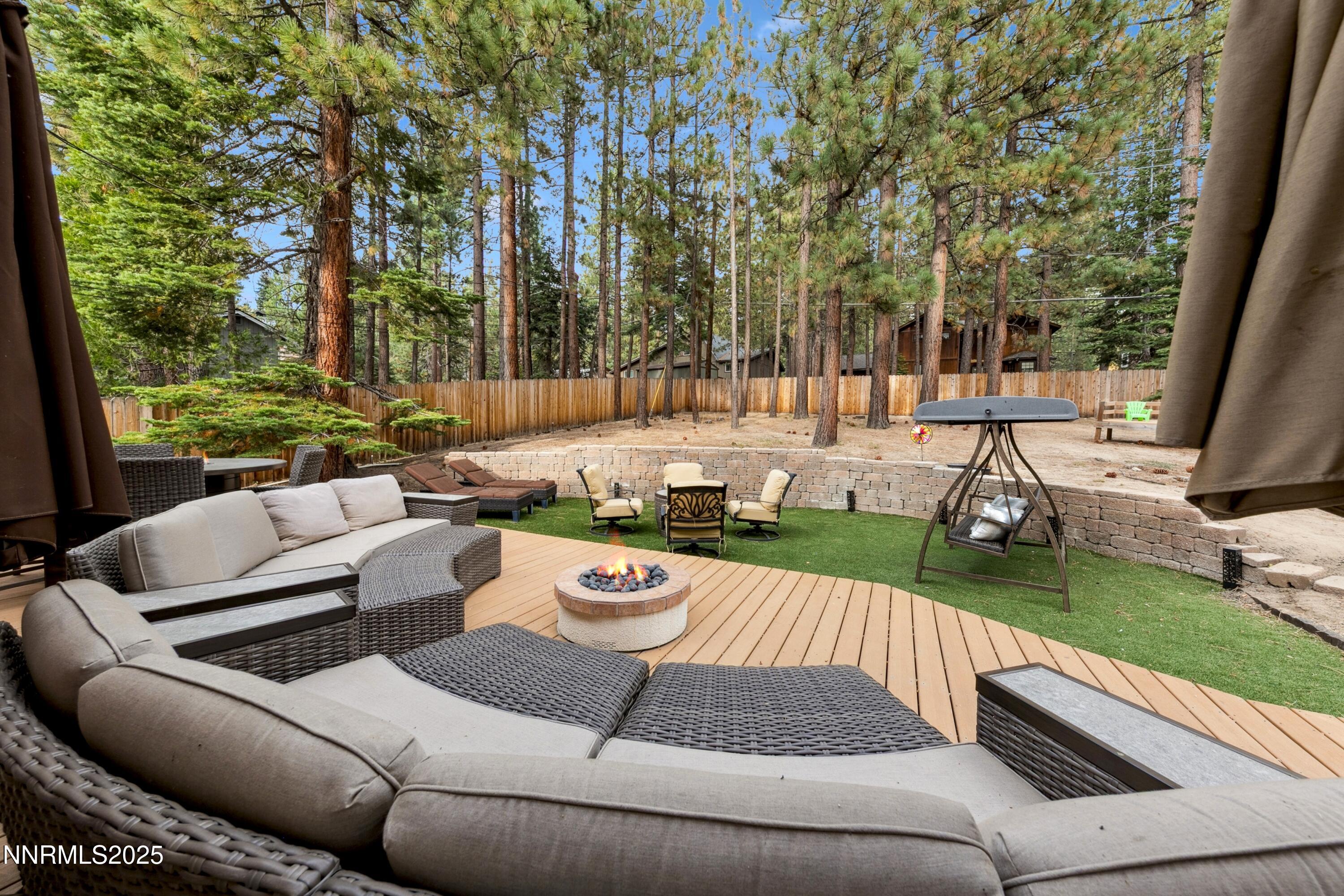 301 Chimney Rock Road Stateline, NV 89449 - Photo 22 of 38 a view of a patio with couches chairs and a big yard