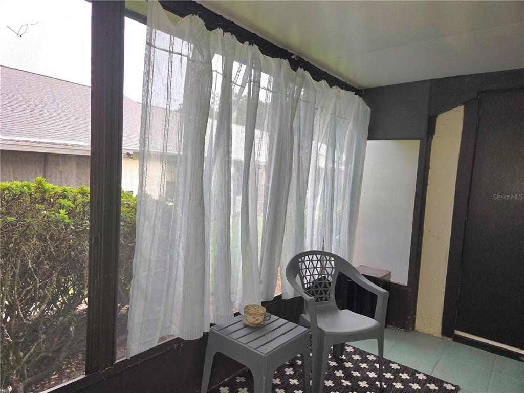 1701 Southeast 24th Road, Unit 1901 Ocala, FL 34471 - Photo 12 of 13 a living room with furniture and a window
