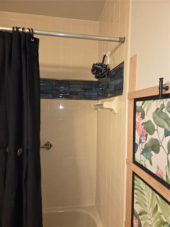 1701 Southeast 24th Road, Unit 1901 Ocala, FL 34471 - Photo 13 of 13 a bathroom with a shower and a sink