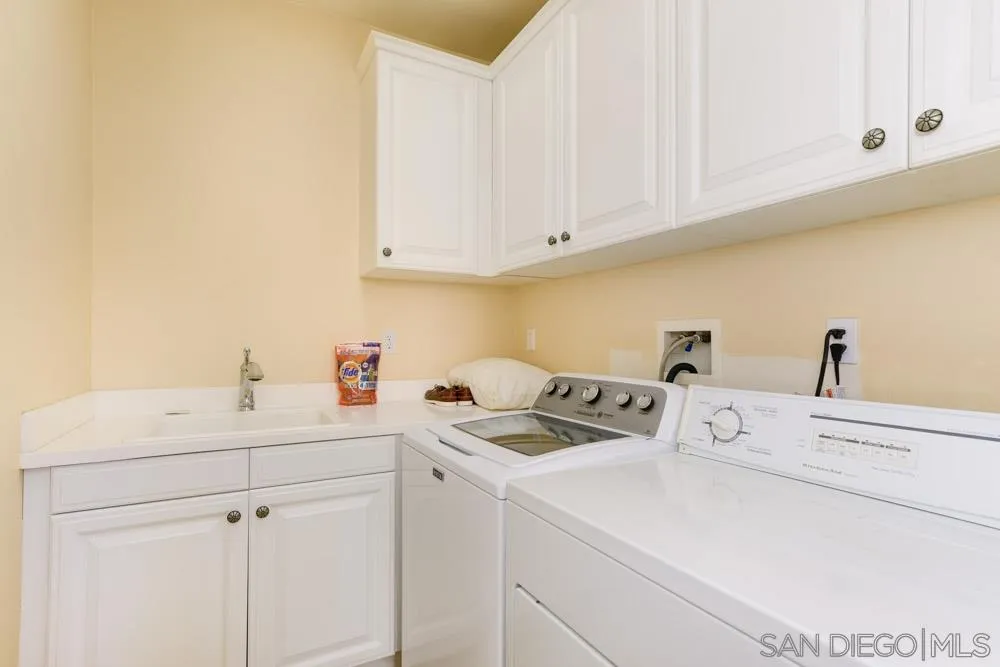 2936 Ranch Gate Road Chula Vista, CA 91914 - Photo 13 of 32 a utility room with sink dryer and washer