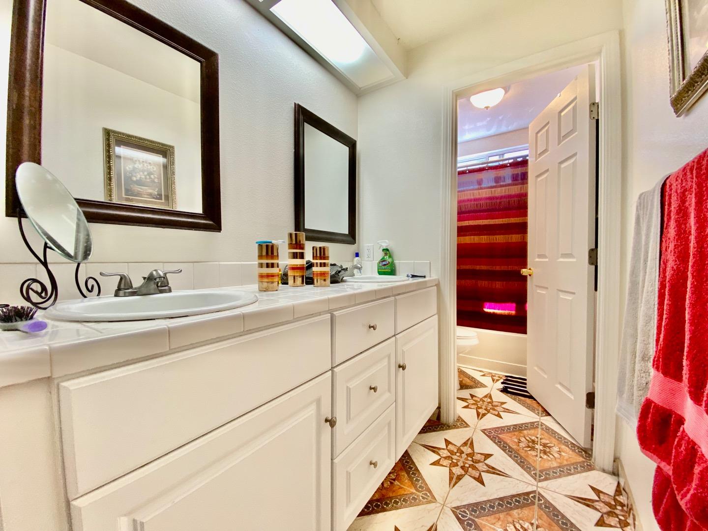 1015 Eagle Drive Salinas, CA 93905 - Photo 11 of 12 a bathroom with a sink and a mirror