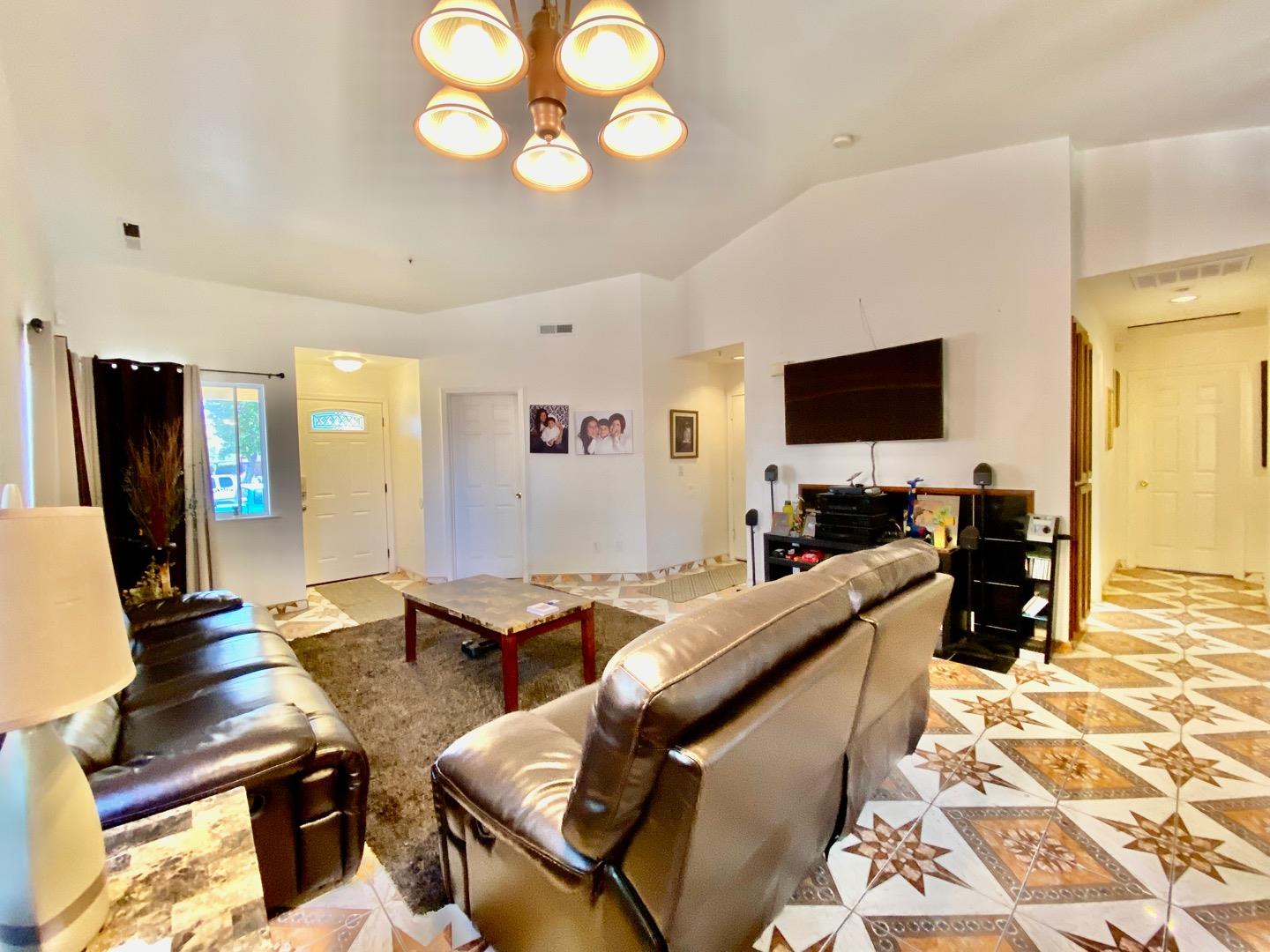 1015 Eagle Drive Salinas, CA 93905 - Photo 3 of 12 a living room with furniture and a flat screen tv