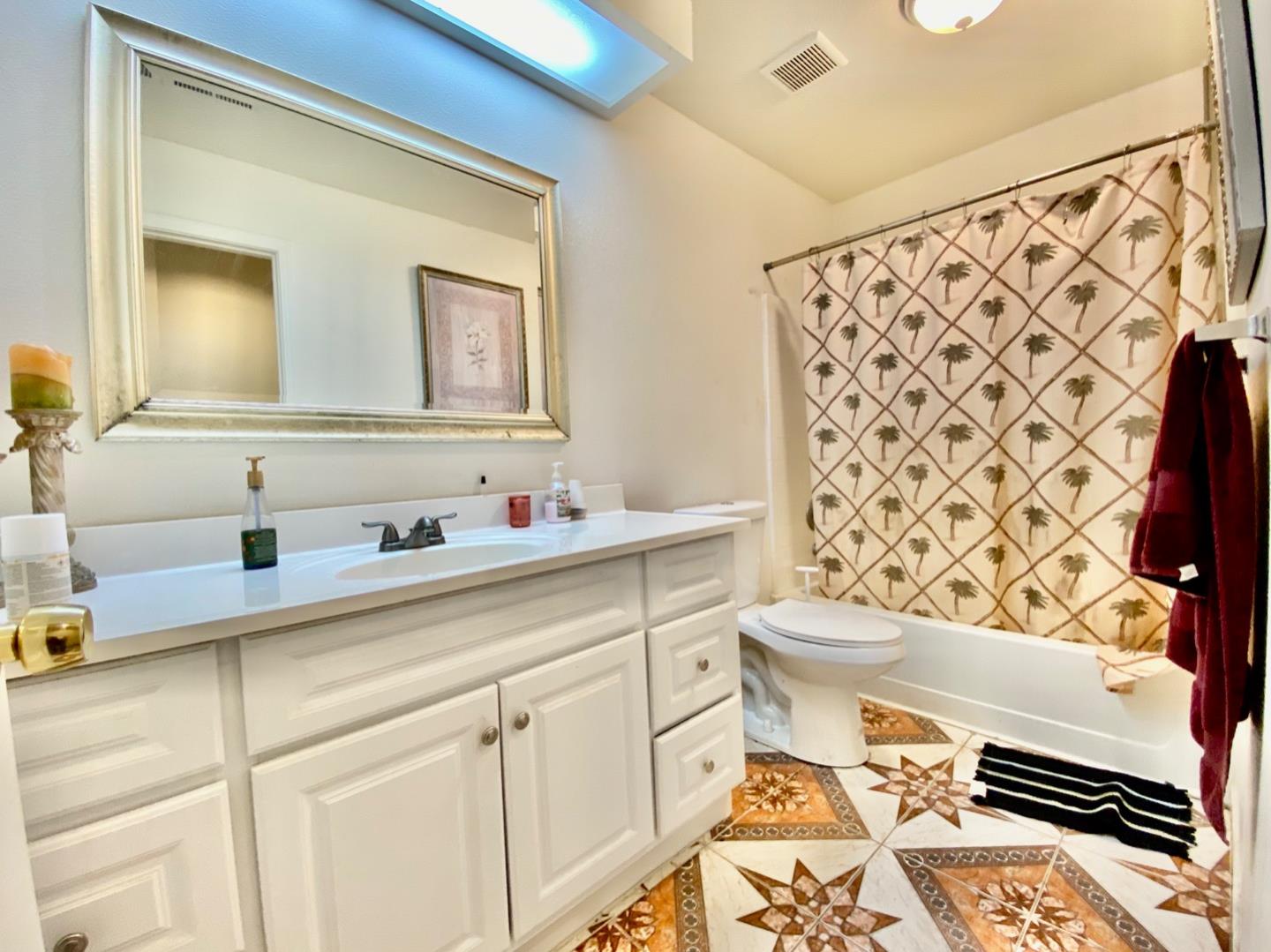 1015 Eagle Drive Salinas, CA 93905 - Photo 7 of 12 a bathroom with a sink a toilet and a mirror