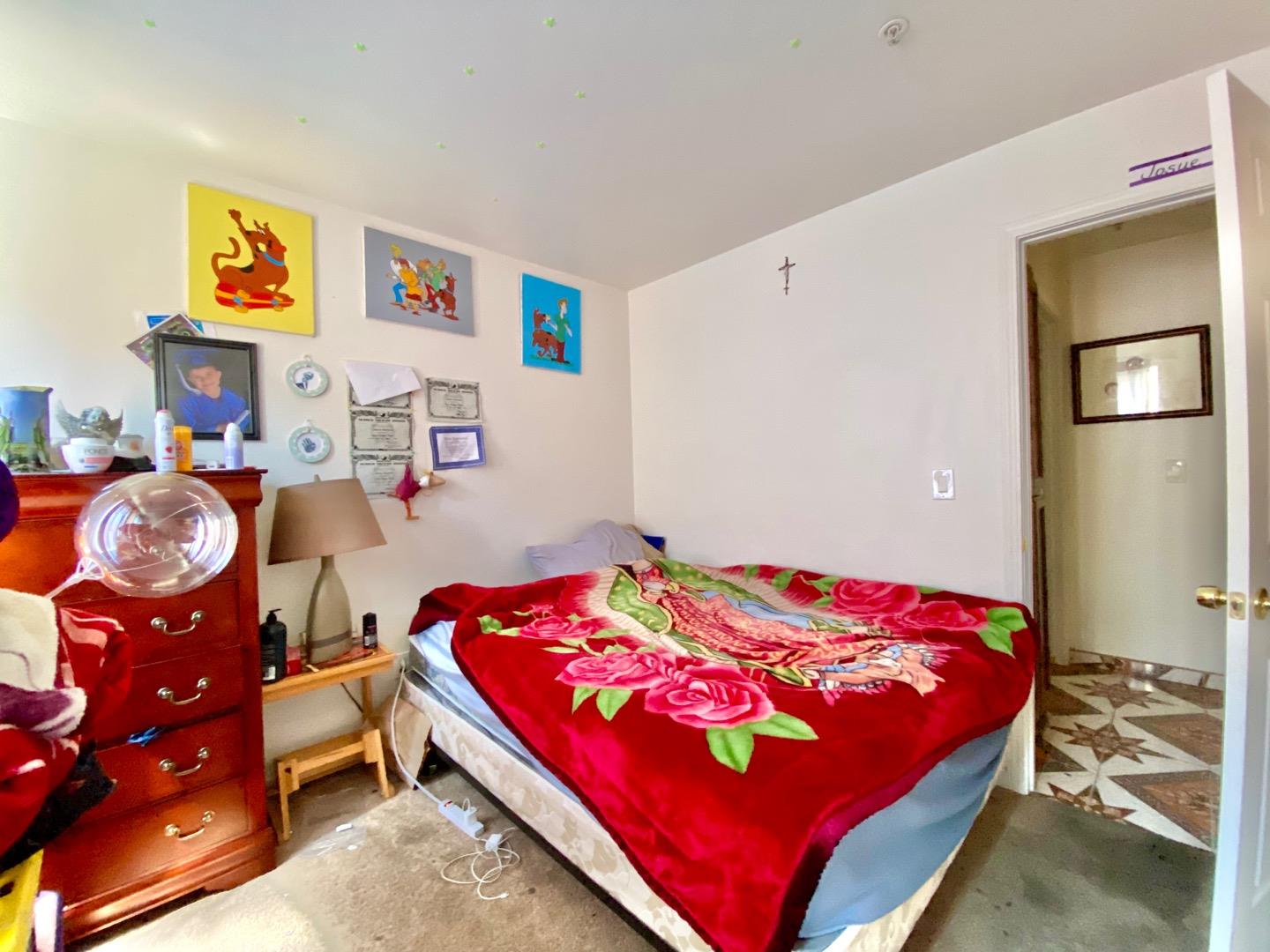 1015 Eagle Drive Salinas, CA 93905 - Photo 9 of 12 a bedroom with a bed and dresser