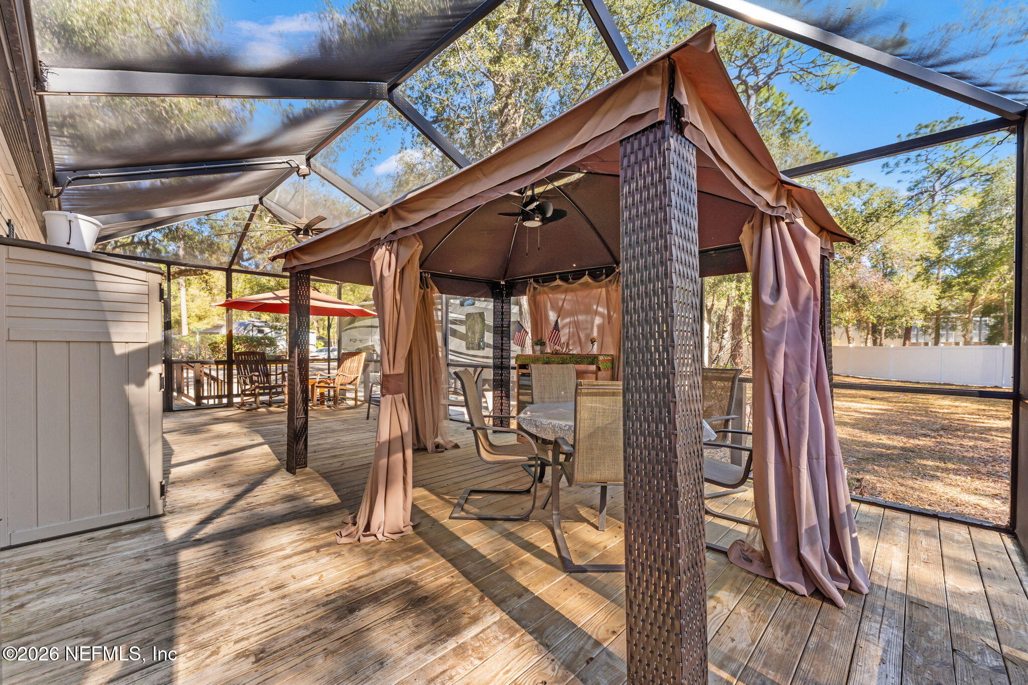 14195 Northeast 252nd Ct Road, Unit 109 Salt Springs, FL 32134 - Photo 16 of 29 gazebo under screened enclosure
