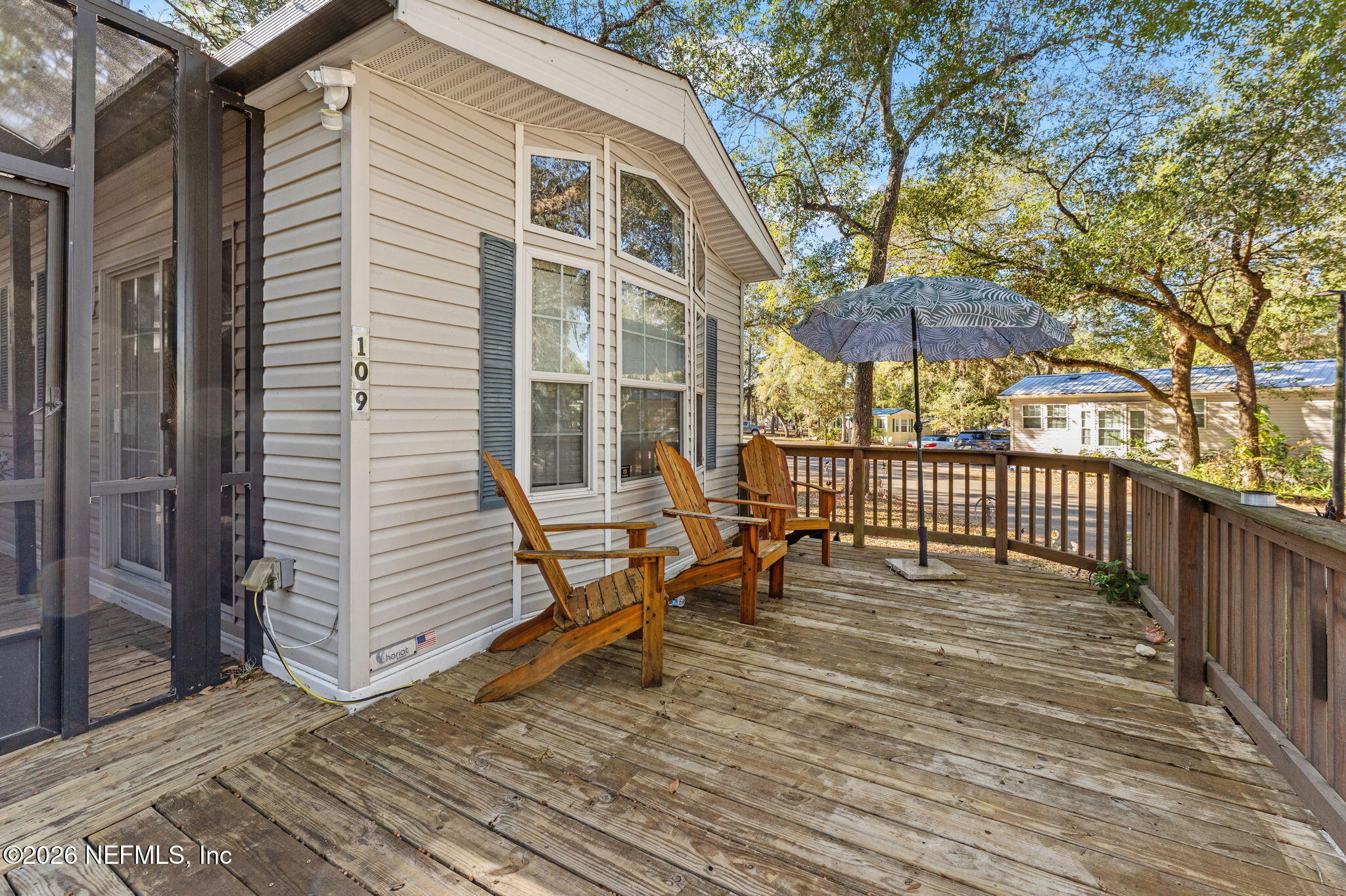 14195 Northeast 252nd Ct Road, Unit 109 Salt Springs, FL 32134 - Photo 4 of 29 front wooden deck