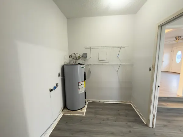 a view of a storage & utility room with utility room