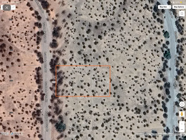 a bathroom with a toilet and a shower curtain