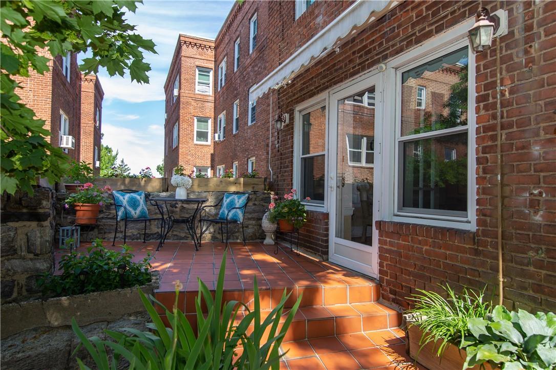 56 Sagamore Road, Unit 2B Bronxville, NY 10708 - Photo 1 of 1 a view of a building with sitting area