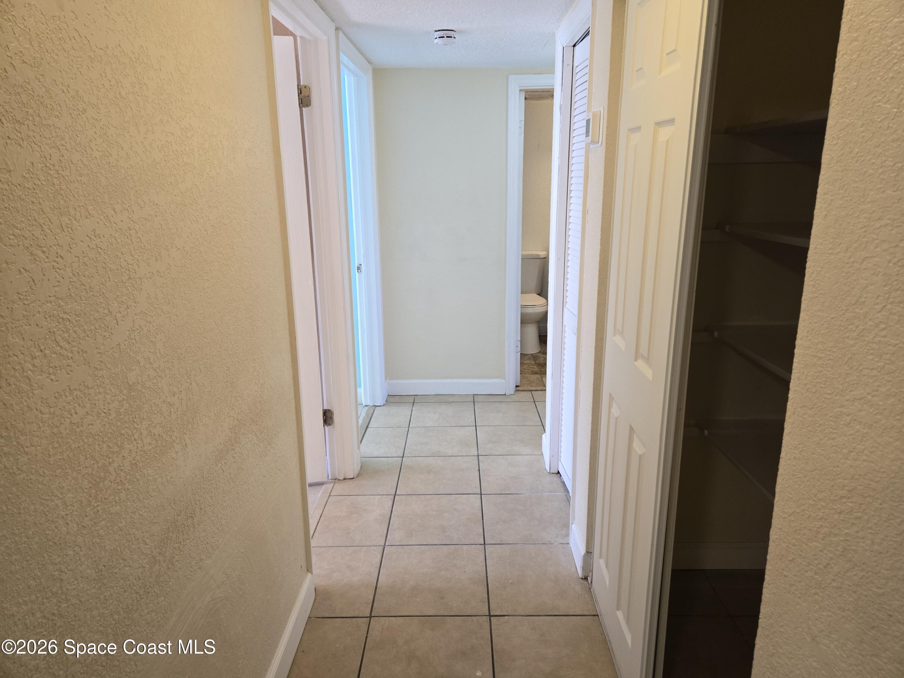 174 Ulster Lane Melbourne, FL 32935 - Photo 12 of 25 a view of a hallway
