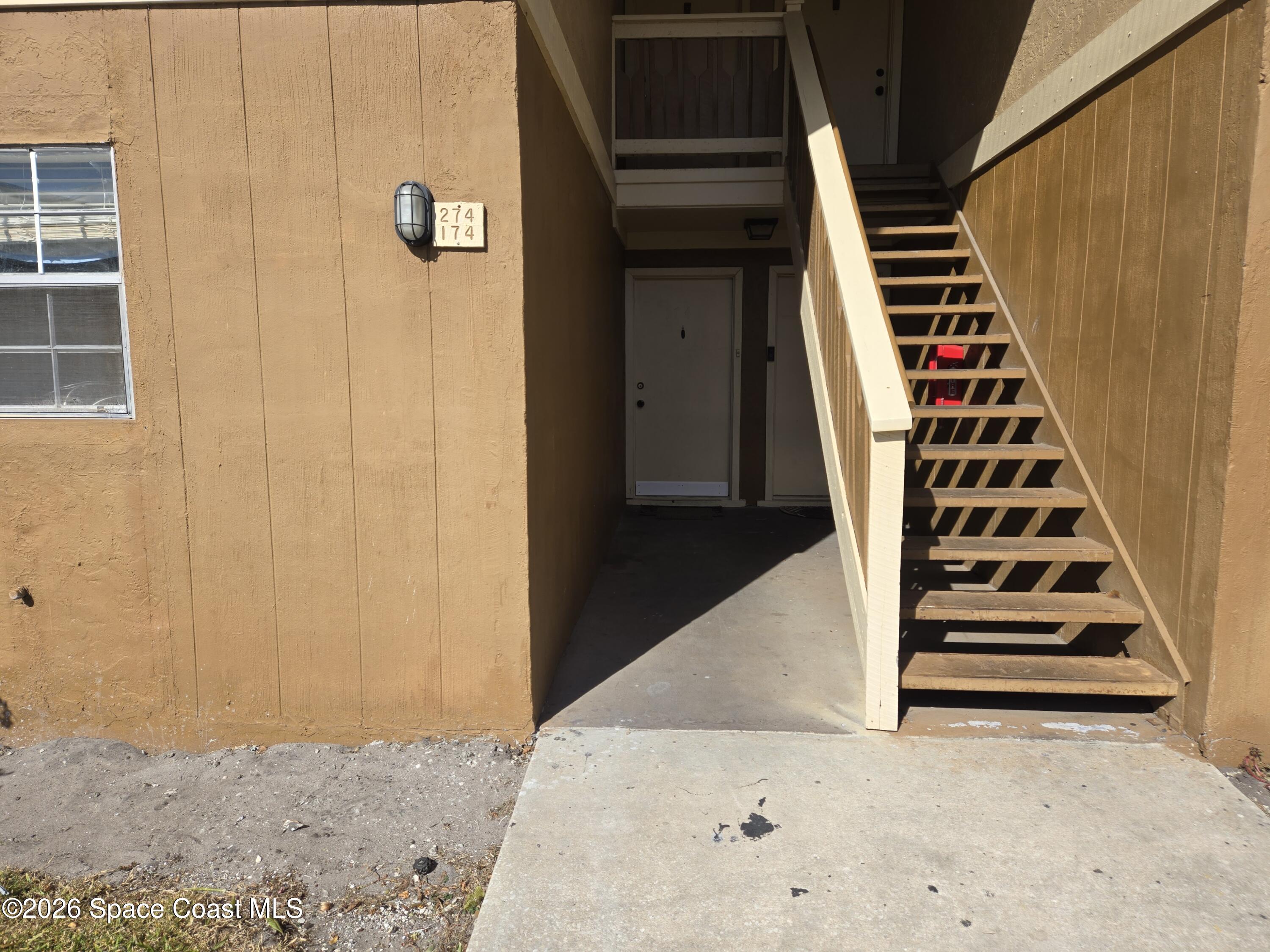 174 Ulster Lane Melbourne, FL 32935 - Photo 2 of 25 a view of wooden floor and windows