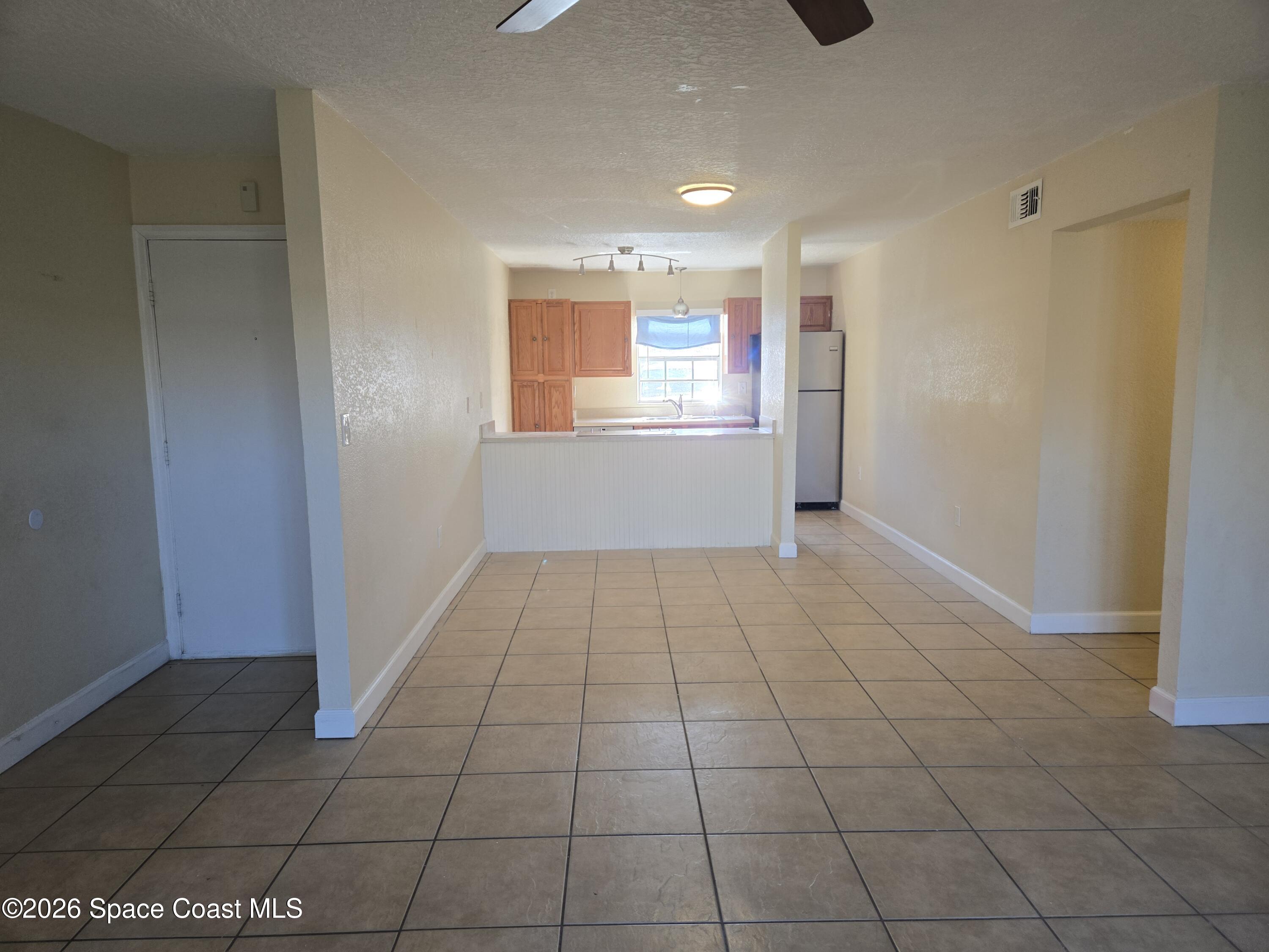 174 Ulster Lane Melbourne, FL 32935 - Photo 3 of 25 a view of an empty room and window