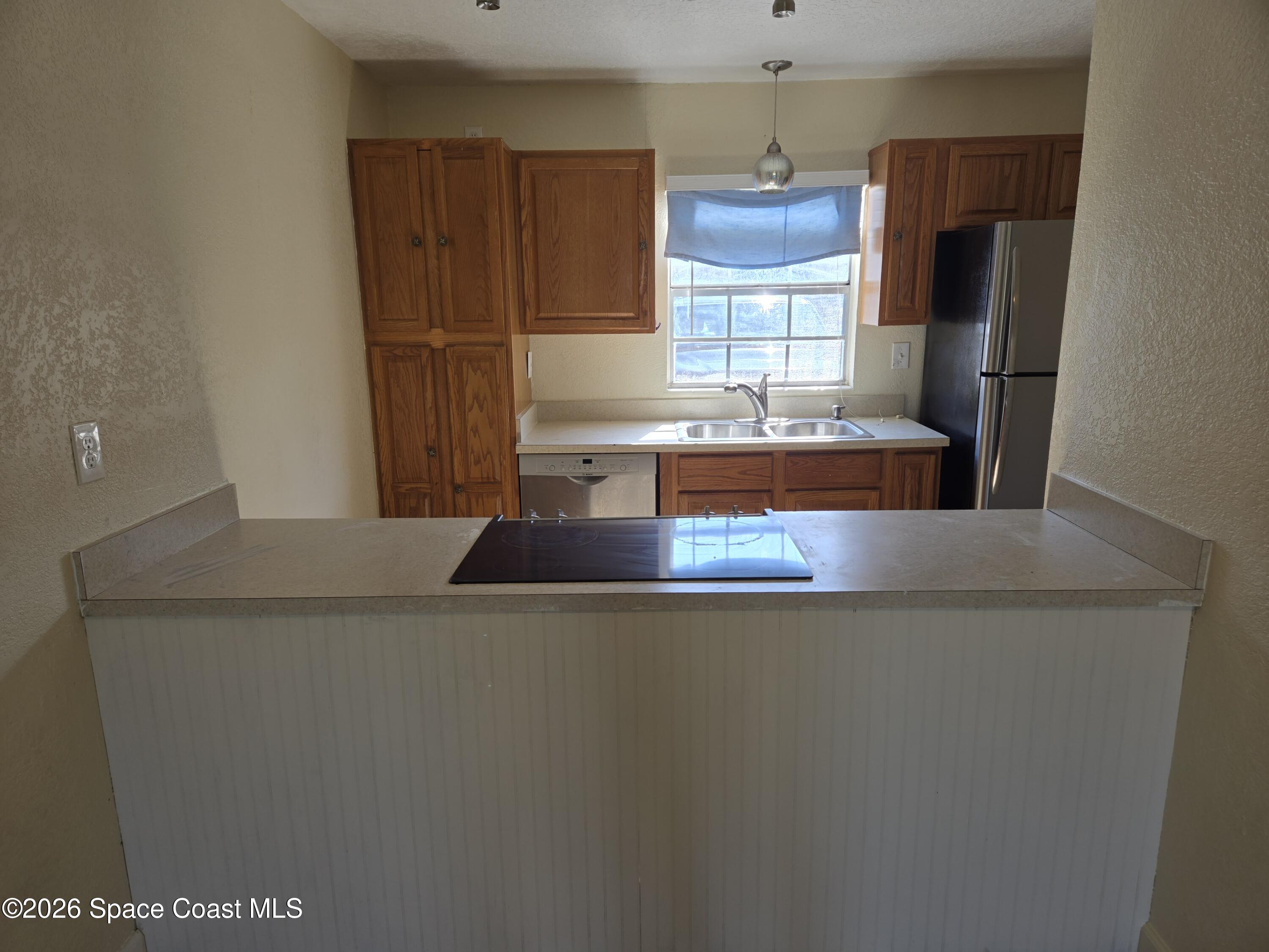 174 Ulster Lane Melbourne, FL 32935 - Photo 10 of 25 a view of kitchen island with furniture