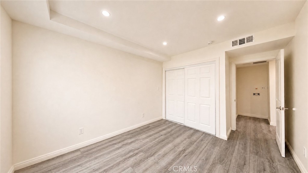 6851 Foothill Boulevard Tujunga, CA 91042 - Photo 42 of 50 a view of hallway with wooden floor