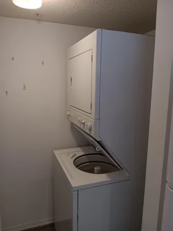 a close view of a sink and washer and dryer