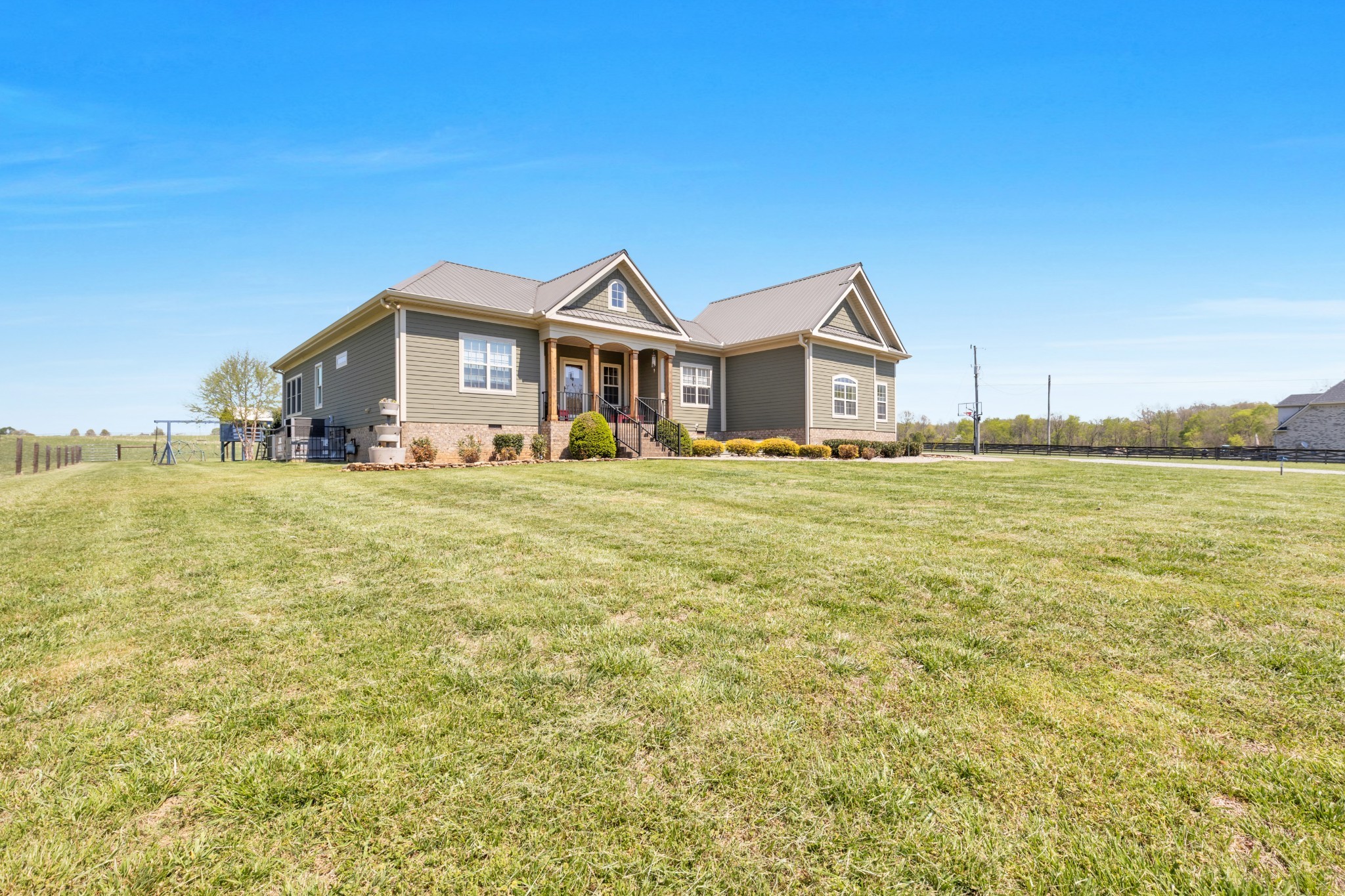 3988 Fykes Grove Road Cedar Hill, TN 37032 - Photo 40 of 50 a big house with a big yard and large trees