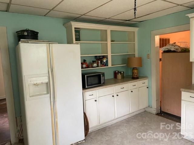 555 Baldwin Avenue Marion, NC 28752 - Photo 7 of 9 a hallway with cabinets washer and dryer