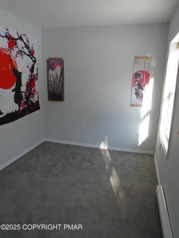 a view of small space with racks on the wall