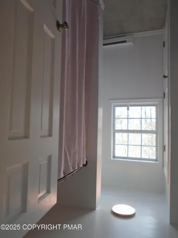 a view of staircase with window