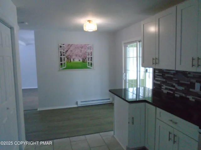 a view of empty room with windows