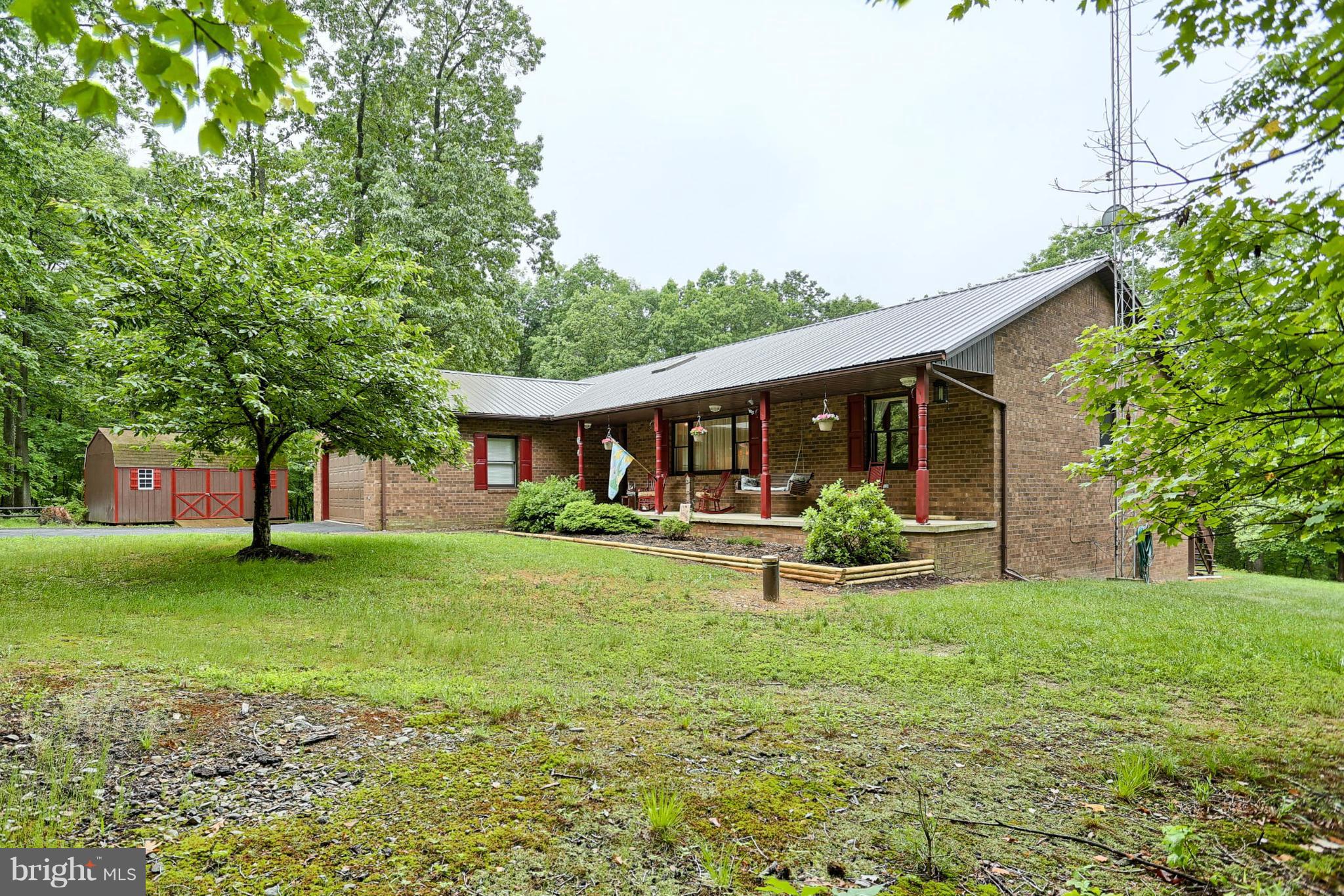 10852 Garrison Hollow Road Clear Spring, MD 21722 - Photo 1 of 30 a front view of a house with garden
