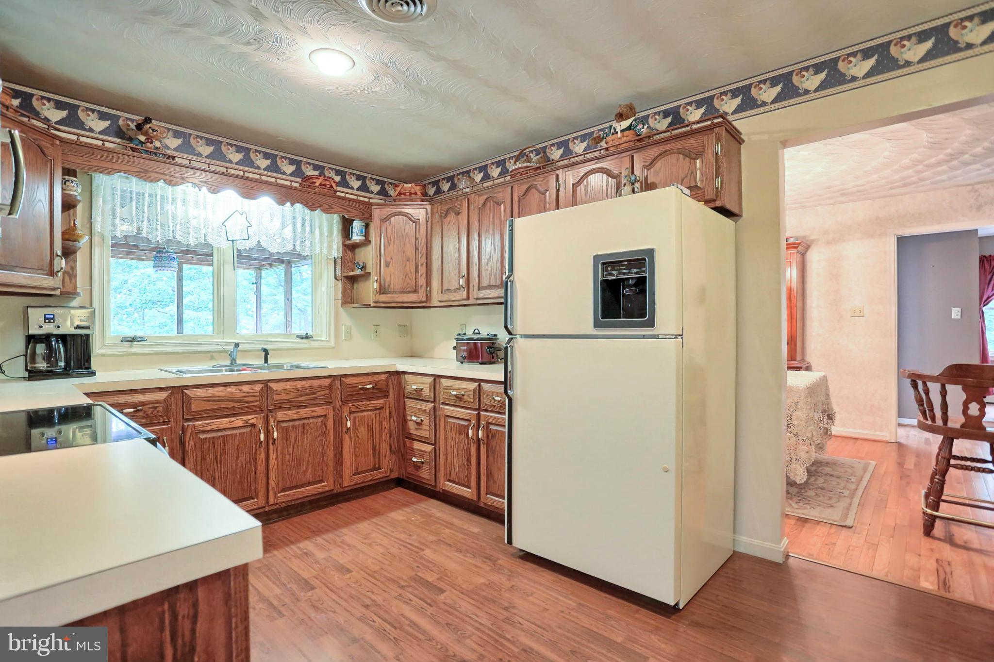 10852 Garrison Hollow Road Clear Spring, MD 21722 - Photo 12 of 30 a kitchen with a sink appliances and cabinets