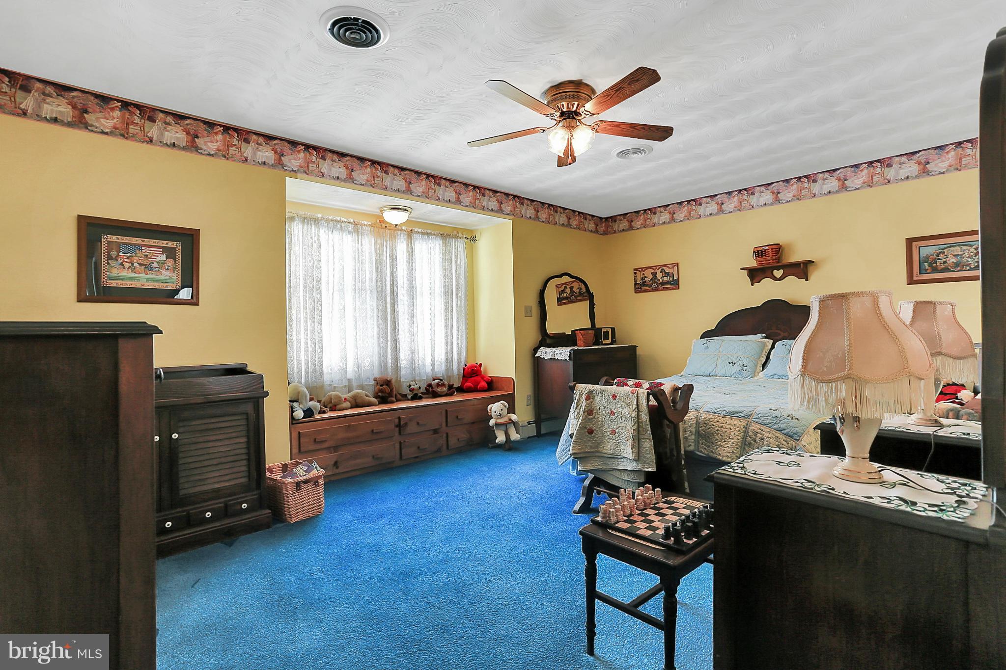 10852 Garrison Hollow Road Clear Spring, MD 21722 - Photo 16 of 30 a bedroom with furniture and a chandelier