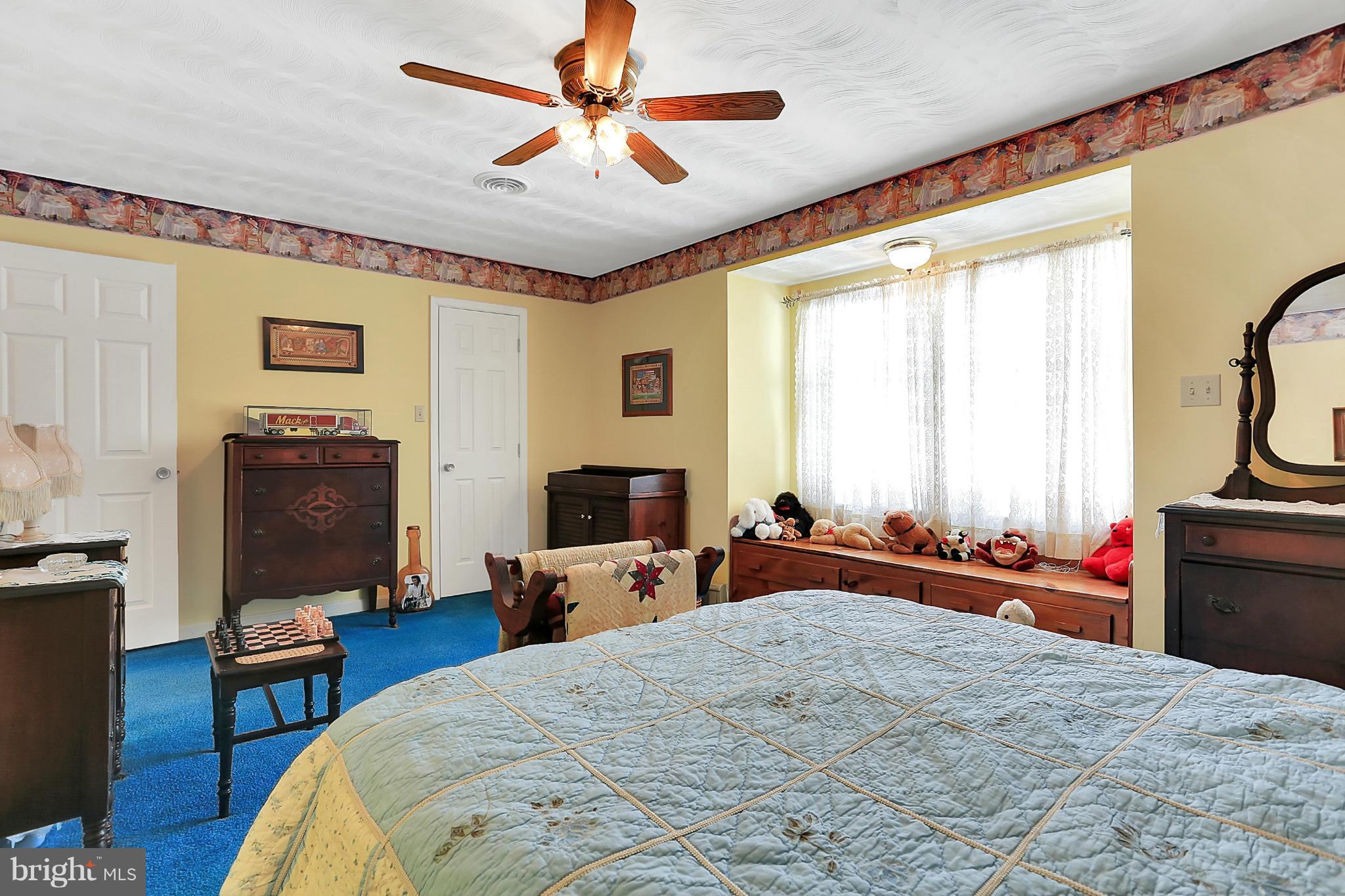 10852 Garrison Hollow Road Clear Spring, MD 21722 - Photo 17 of 30 a bed room with a bed and a television