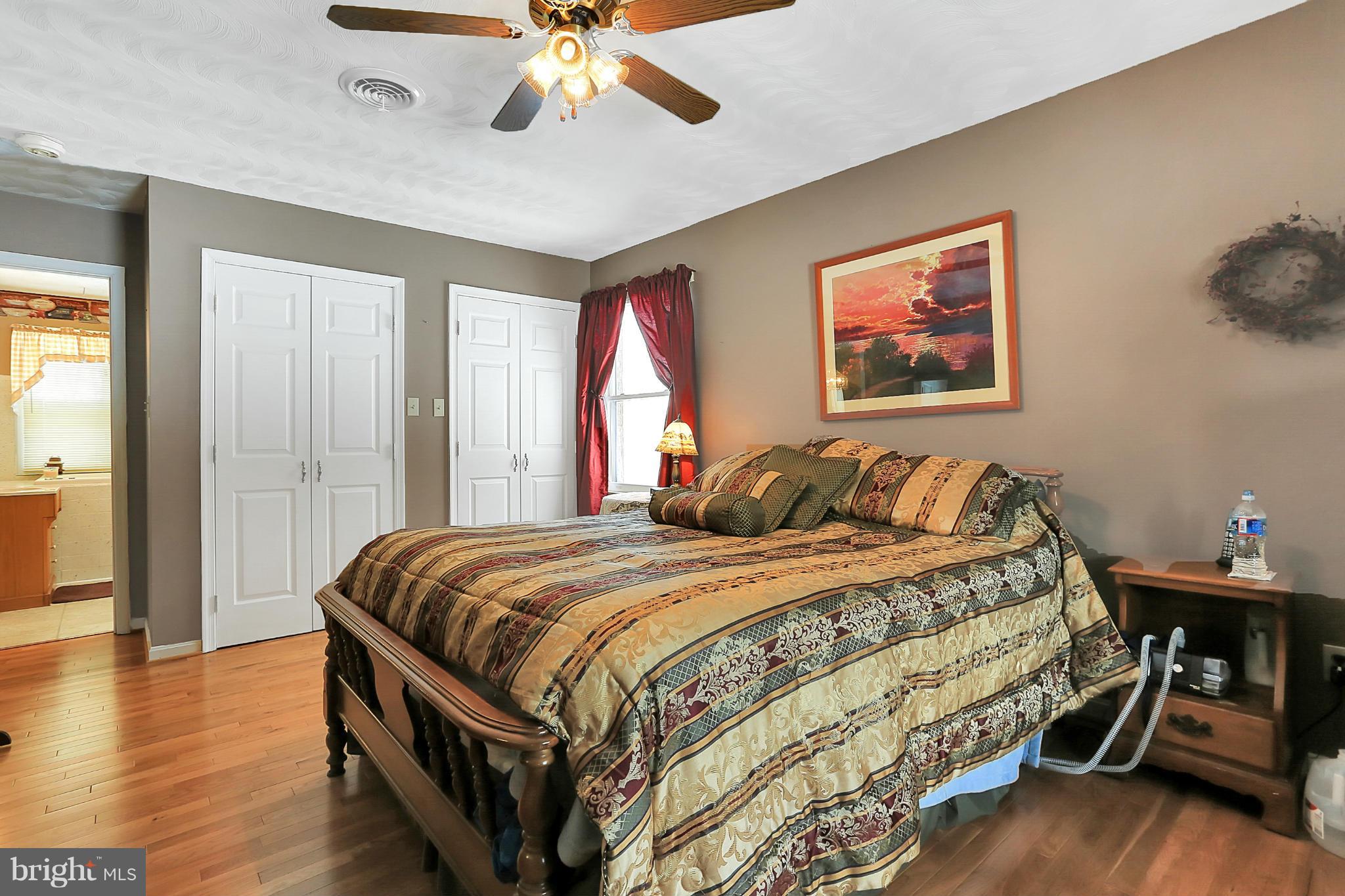 10852 Garrison Hollow Road Clear Spring, MD 21722 - Photo 22 of 30 a bed sitting in a bedroom next to a window