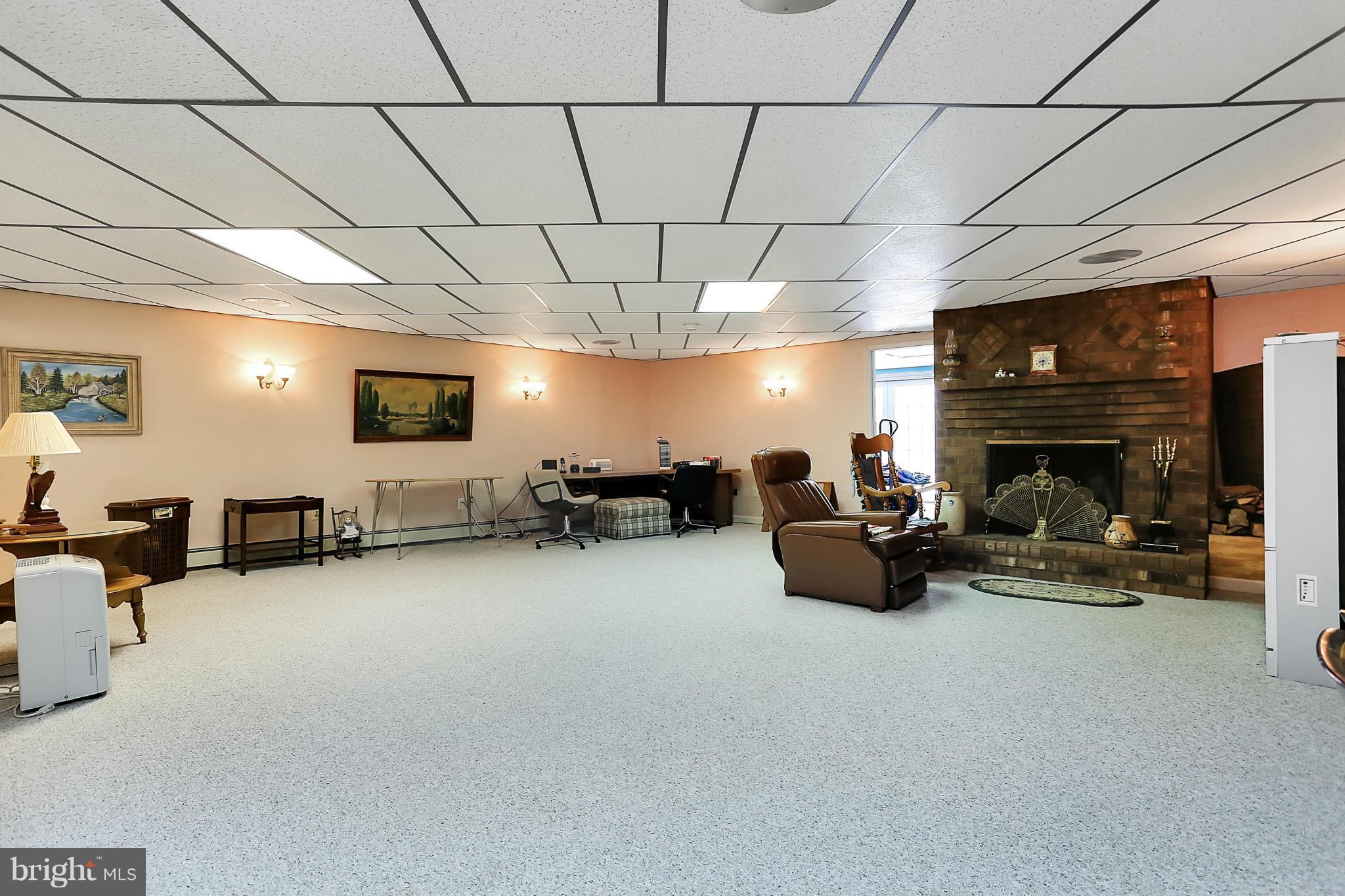 10852 Garrison Hollow Road Clear Spring, MD 21722 - Photo 25 of 30 a living room with furniture and a flat screen tv