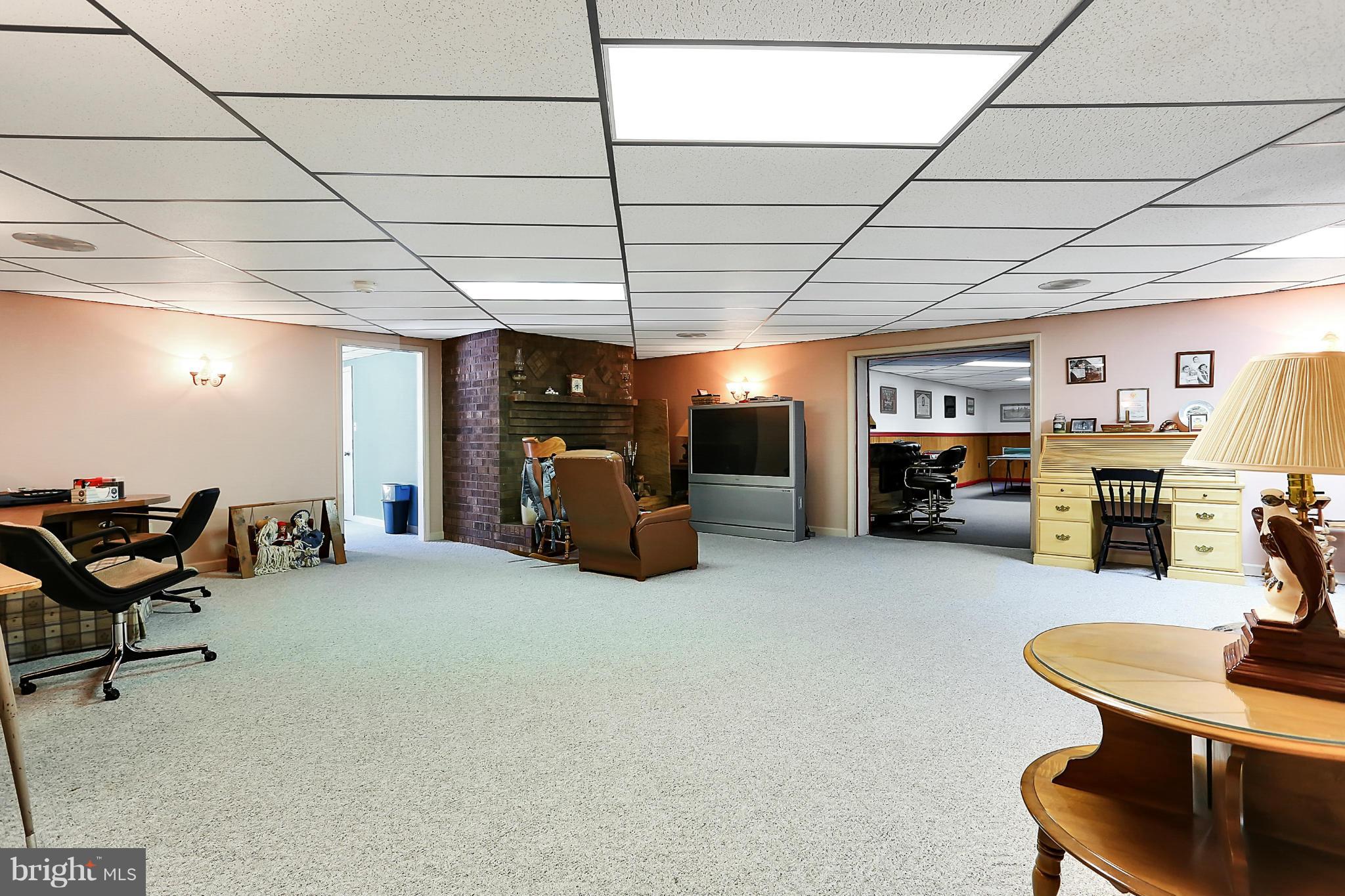 10852 Garrison Hollow Road Clear Spring, MD 21722 - Photo 26 of 30 a room with furniture and a flat screen tv