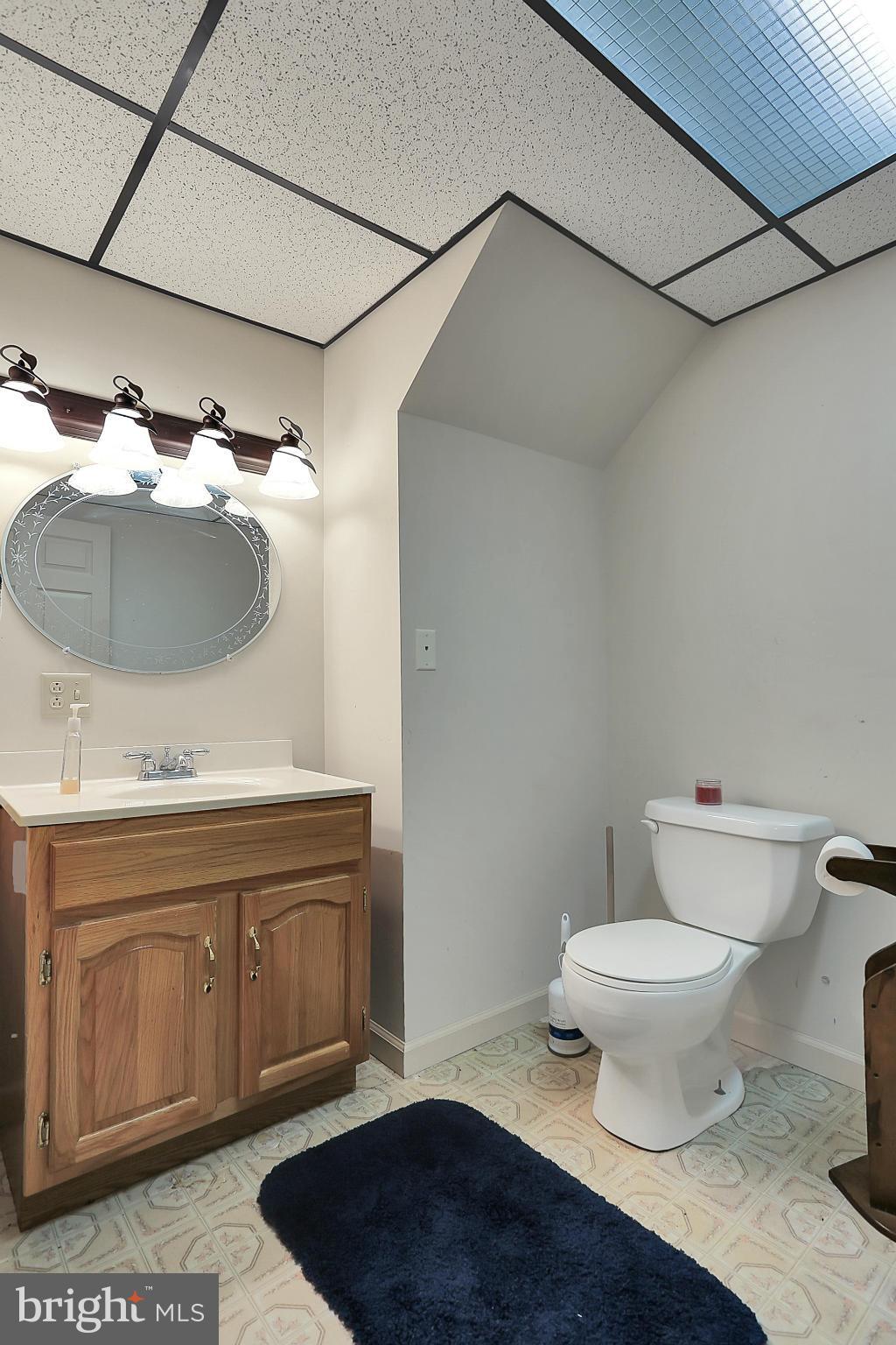 10852 Garrison Hollow Road Clear Spring, MD 21722 - Photo 30 of 30 a bathroom with a sink toilet and mirror