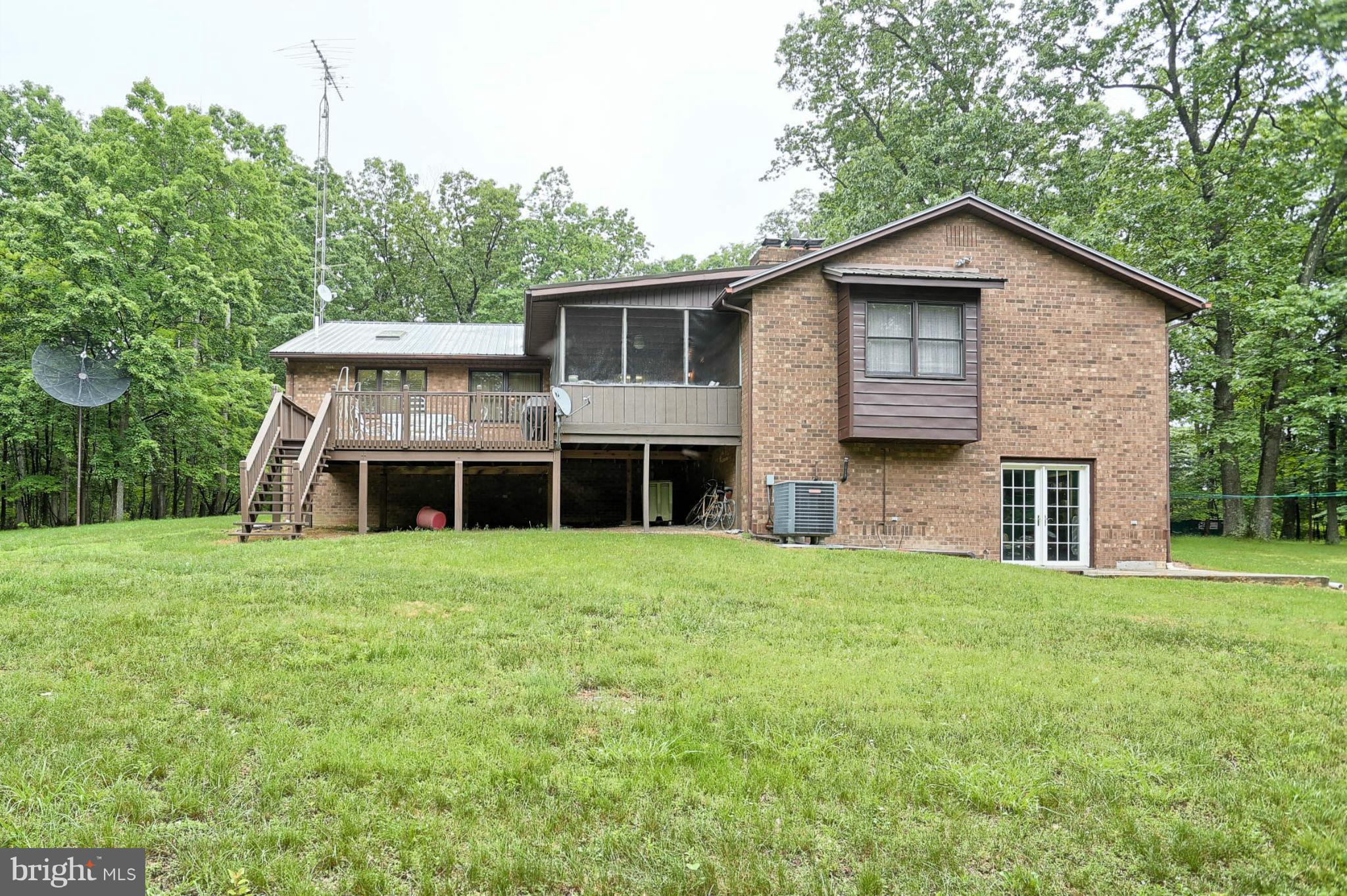10852 Garrison Hollow Road Clear Spring, MD 21722 - Photo 4 of 30 a front view of a house with a garden