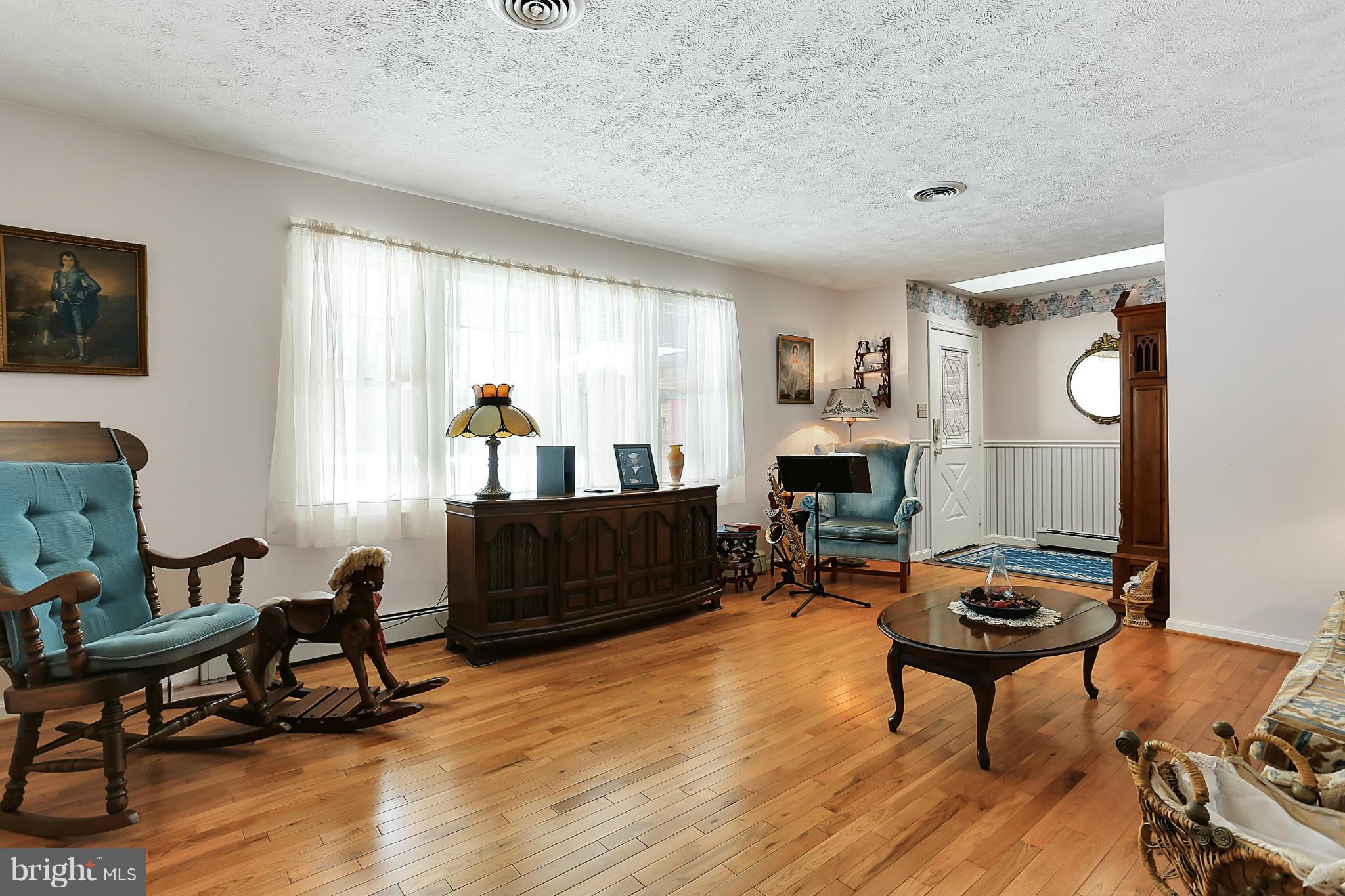 10852 Garrison Hollow Road Clear Spring, MD 21722 - Photo 5 of 30 a living room with furniture and a wooden floor