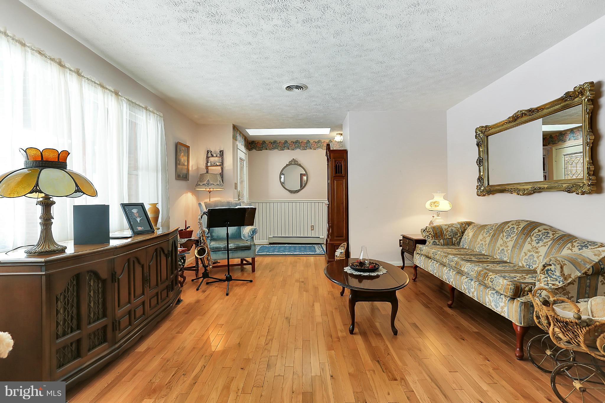 10852 Garrison Hollow Road Clear Spring, MD 21722 - Photo 6 of 30 a living room with furniture and a wooden floor