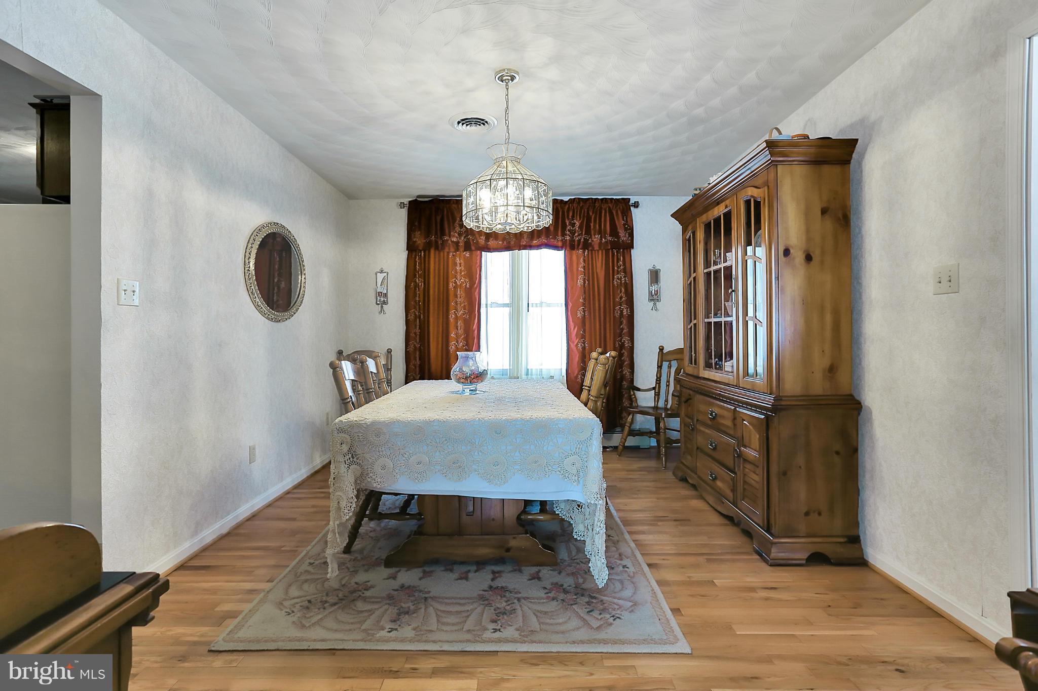 10852 Garrison Hollow Road Clear Spring, MD 21722 - Photo 7 of 30 a very nice looking room with wooden floor and furniture